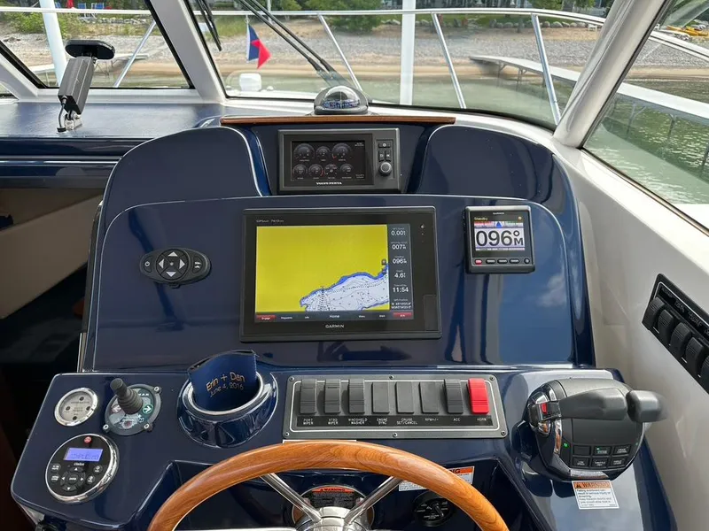 Slide: The Image of TIARA 31' Coronet; Helm, Garmin, spot light, bow thruster, cup holder, Electronic Controls, Tiara's Steering wheel - 11