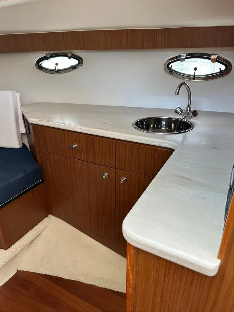 Slide: The Image of TIARA 31' Coronet Galley, storage in drawers & cupboards, note port lights w/screens - 9