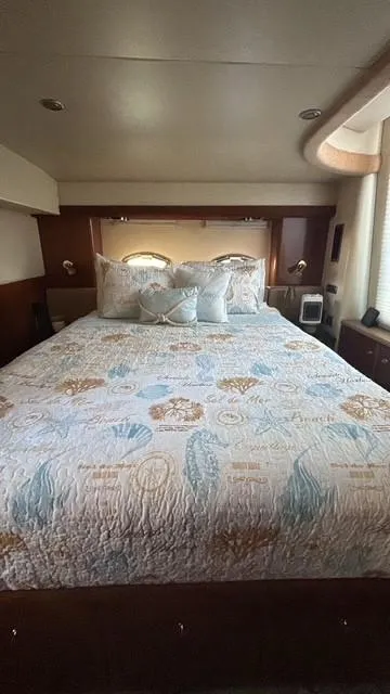Slide: The Image of Luxurious bedroom interior of 2007 Meridian 459 Motoryacht with elegant bedding. - 13