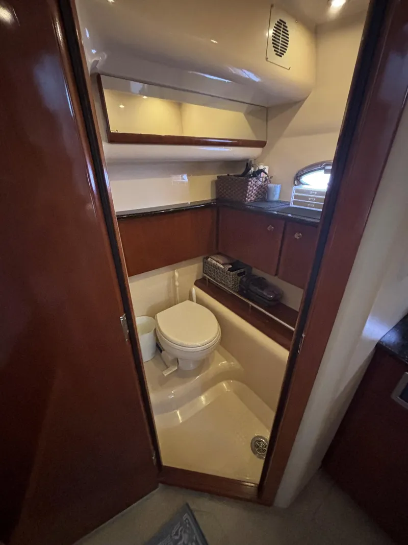 Slide: The Image of 2007 Meridian 459 Motoryacht bathroom with wooden cabinets and modern fixtures. - 15