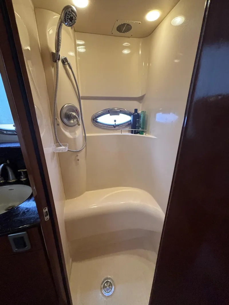 Slide: The Image of Luxurious shower in 2007 Meridian 459 Motoryacht with modern fixtures and porthole window. - 16