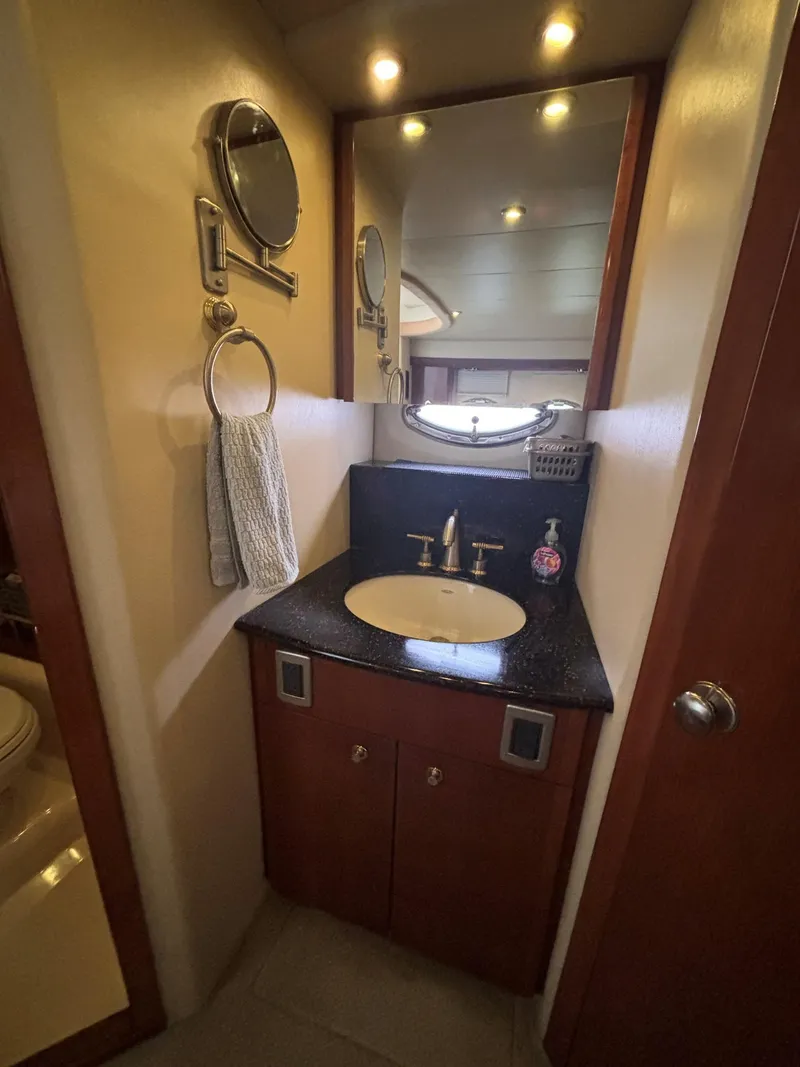 Slide: The Image of 2007 Meridian 459 Motoryacht bathroom with sink, mirror, and towel holder. - 18