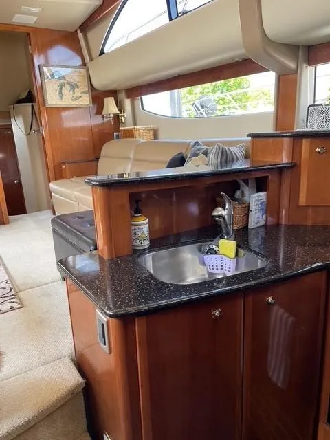 Slide: The Image of Interior of 2007 Meridian 459 Motoryacht with kitchenette and seating area. - 23