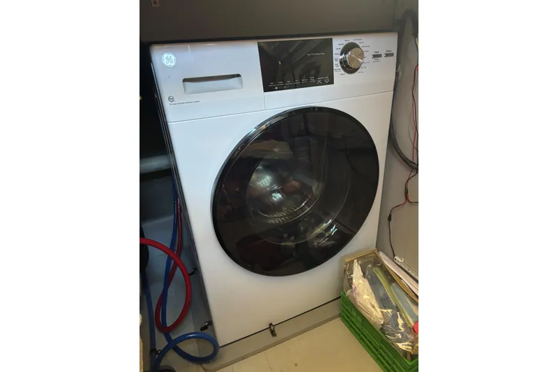 Slide: The Image of GE front-load washing machine in a 2007 Meridian 459 Motoryacht laundry area. - 25