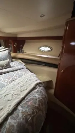 Slide: The Image of Luxurious cabin interior of 2007 Meridian 459 Motoryacht with elegant bedding and wood accents. - 27
