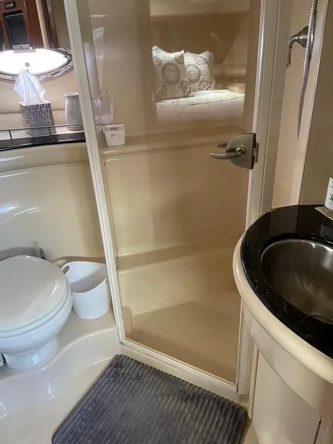 Slide: The Image of 2007 Meridian 459 Motoryacht bathroom with shower, sink, and toilet. - 28