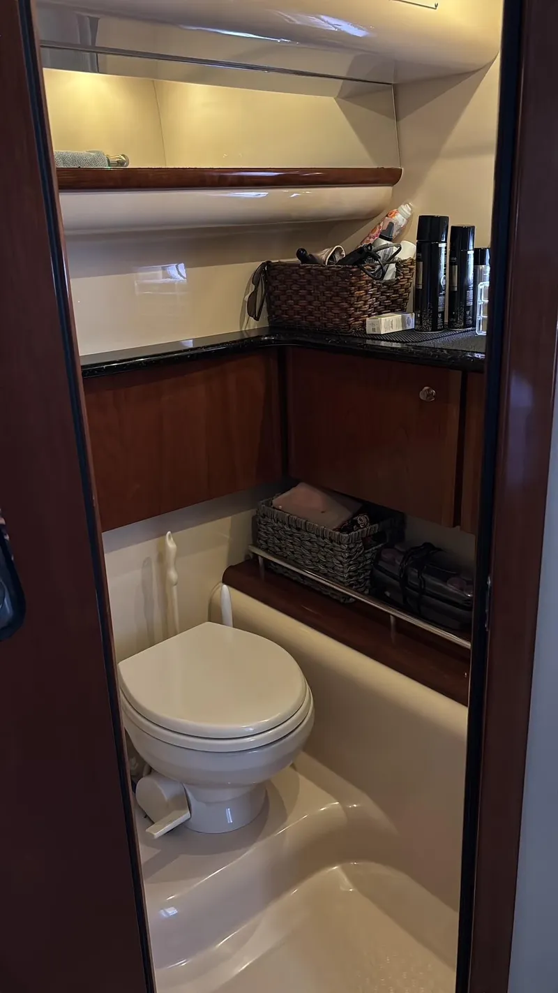 Slide: The Image of 2007 Meridian 459 Motoryacht bathroom with wooden cabinetry and modern amenities. - 30