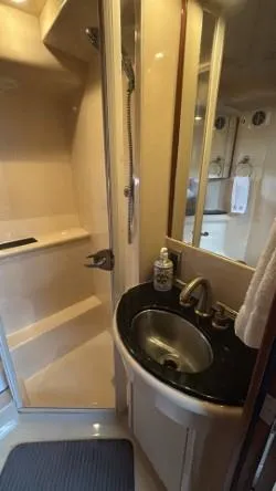Slide: The Image of Bathroom interior of a 2007 Meridian 459 Motoryacht with sink and shower. - 31