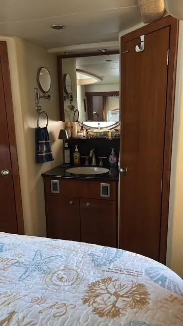 Slide: The Image of Interior of 2007 Meridian 459 Motoryacht with bathroom vanity and nautical-themed bedding. - 33