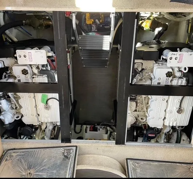 Slide: The Image of Engine room of a 2007 Meridian 459 Motoryacht, showcasing dual engines and mechanical components. - 34