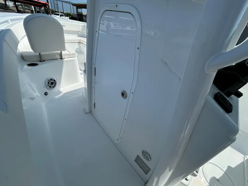 Slide: The Image of 2025 Sea Hunt Gamefish 25 boat interior with seating and storage compartment. - 19