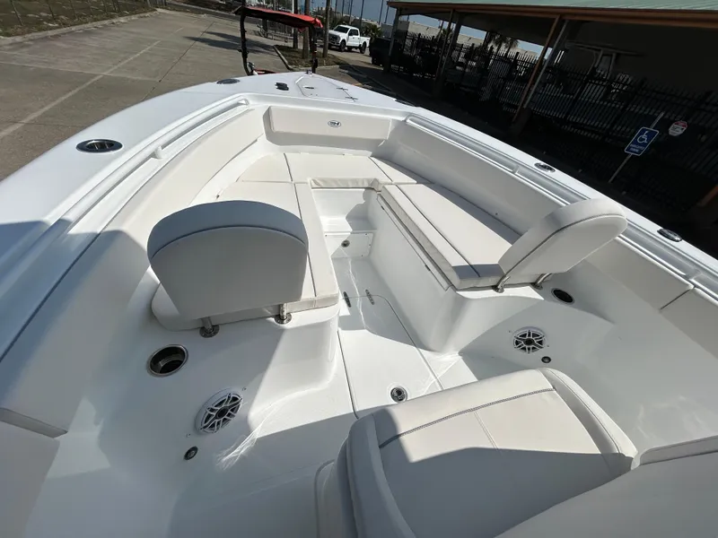 Slide: The Image of 2025 Sea Hunt Gamefish 25 boat interior with white seating and deck. - 21