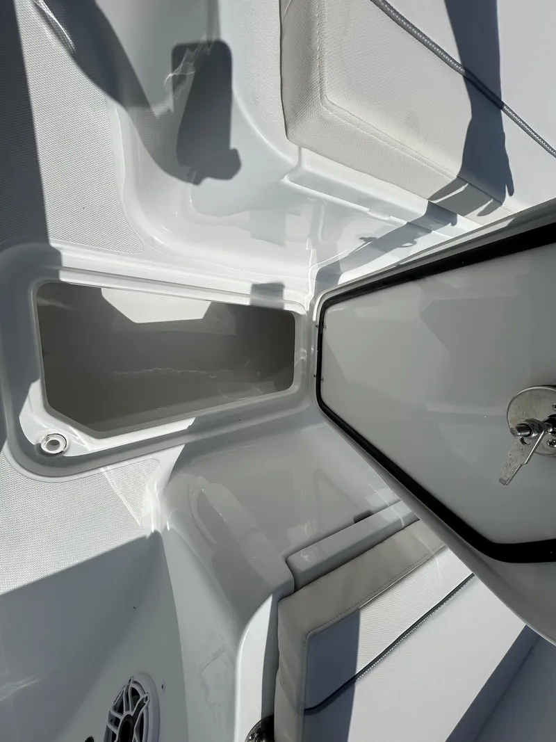 Slide: The Image of 2025 Sea Hunt Gamefish 25 boat interior with storage compartment and seating. - 22