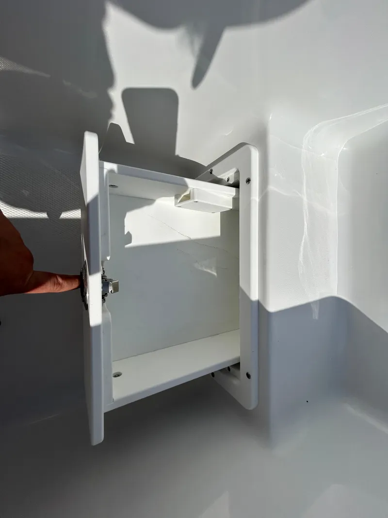 Slide: The Image of Open storage compartment on 2025 Sea Hunt Gamefish 25 boat, showcasing interior space. - 23