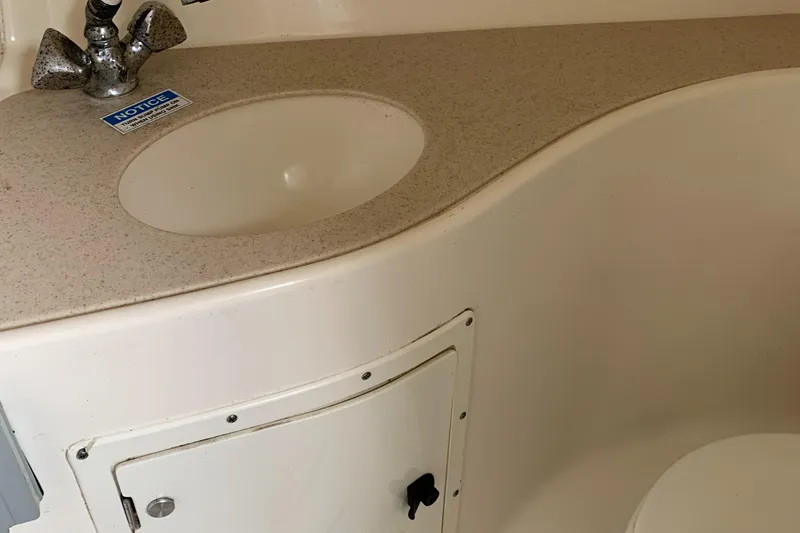 Slide: The Image of Boat bathroom sink and counter in a 2000 Pursuit 2860 Denali. - 10