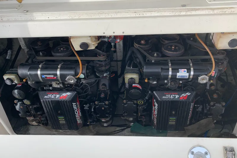 Slide: The Image of Twin MerCruiser engines in a 2000 Pursuit 2860 Denali boat. - 24