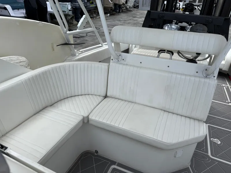 Slide: The Image of White seating area on a 1999 Intrepid 339 Walkaround boat. - 7