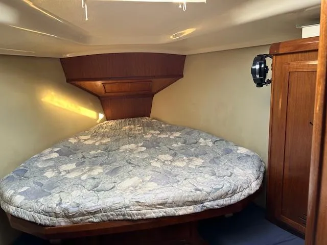 Slide: The Image of Cozy cabin interior of 1993 Hunter Passage 42 sailboat with a comfortable bed. - 11