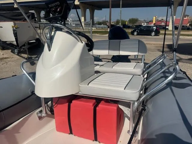 Slide: The Image of 2019 Zodiac Bayrunner 420 inflatable boat interior with steering console and seating. - 10