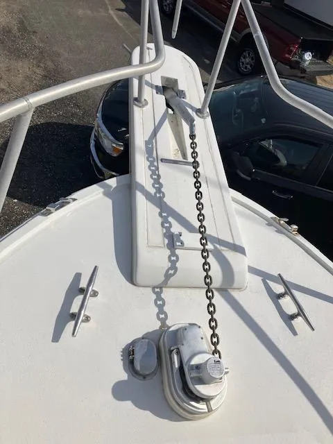 Slide: The Image of 1987 Blackfin 32 Flybridge boat deck with anchor chain and railing. - 6