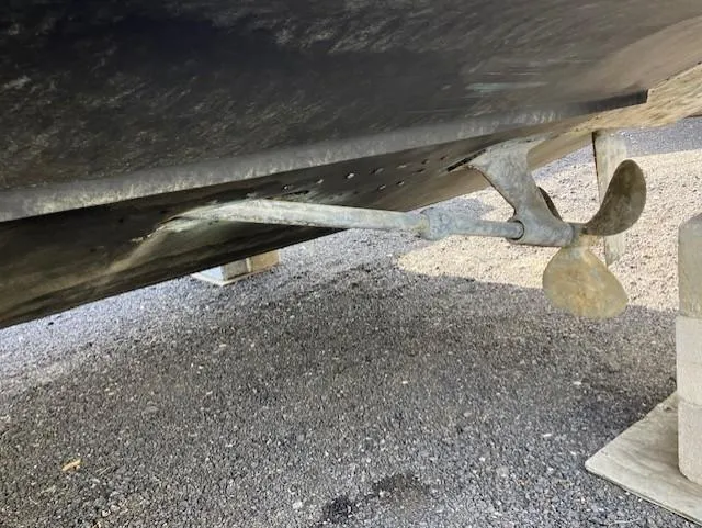 Slide: The Image of 1987 Blackfin 32 Flybridge boat propeller and hull on dry dock. - 8