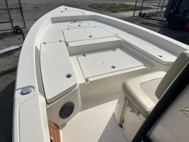 Slide: The Image of 2019 Pathfinder 2400 TRS boat deck with storage compartments and seating. - 11
