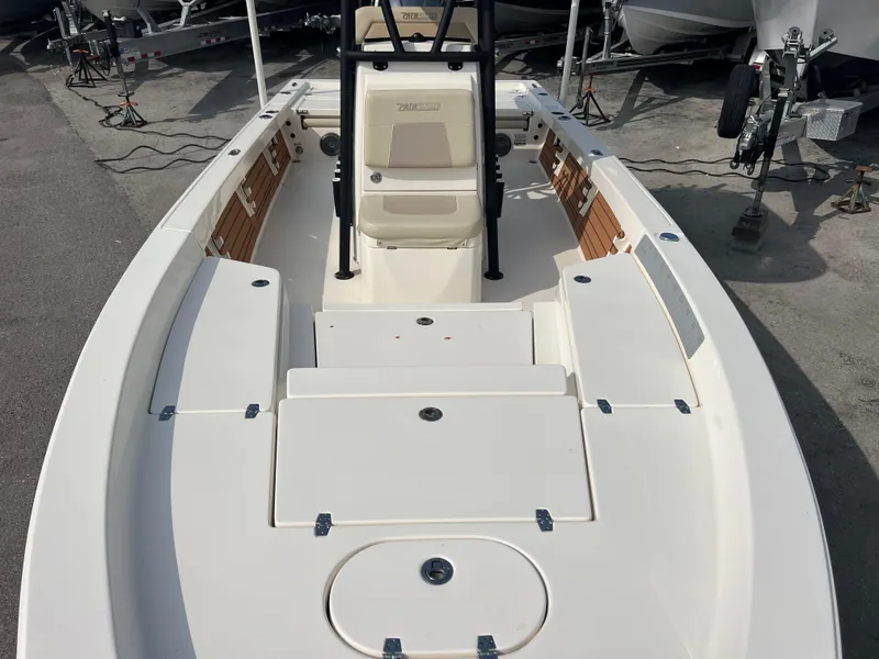 Slide: The Image of 2019 Pathfinder 2400 TRS boat interior, featuring spacious deck and seating. - 12