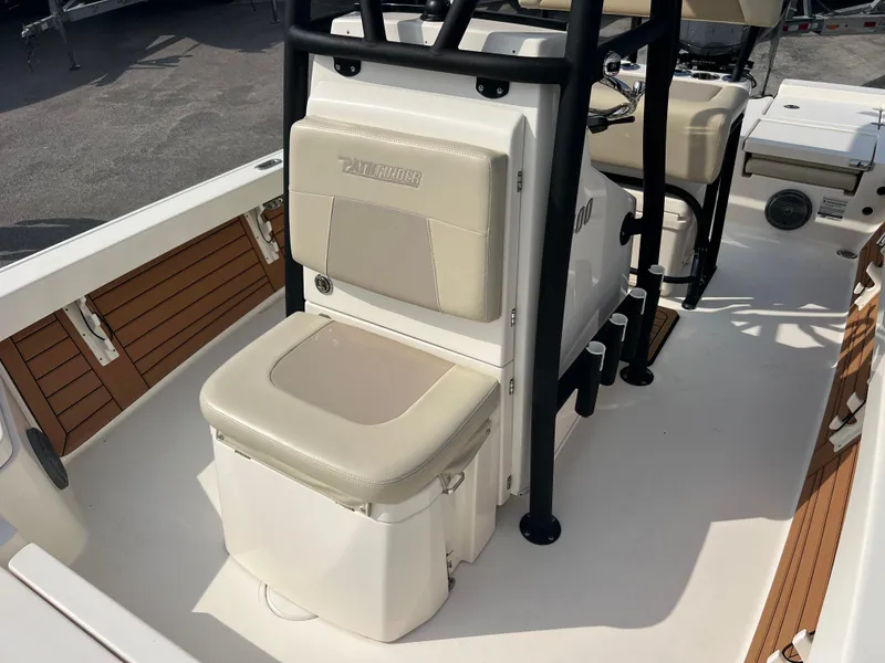 Slide: The Image of 2019 Pathfinder 2400 TRS boat interior with cushioned seating and storage. - 13