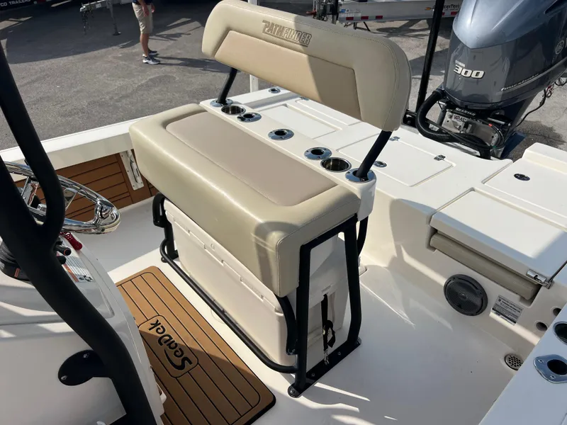 Slide: The Image of 2019 Pathfinder 2400 TRS boat interior with cushioned seating and Yamaha 300 engine. - 14