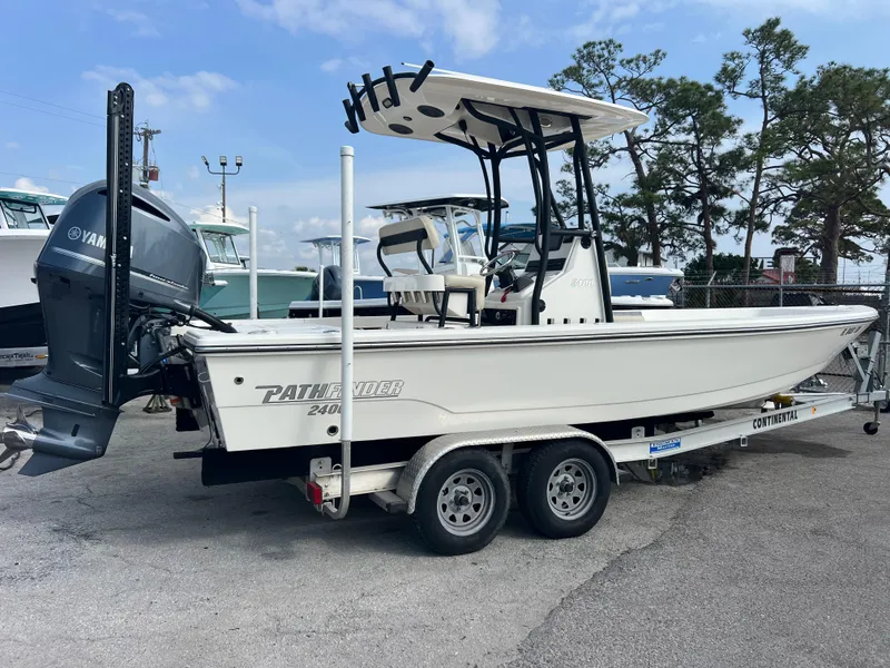 Slide: The Image of 2019 Pathfinder 2400 TRS boat on trailer with Yamaha engine, parked outdoors. - 4