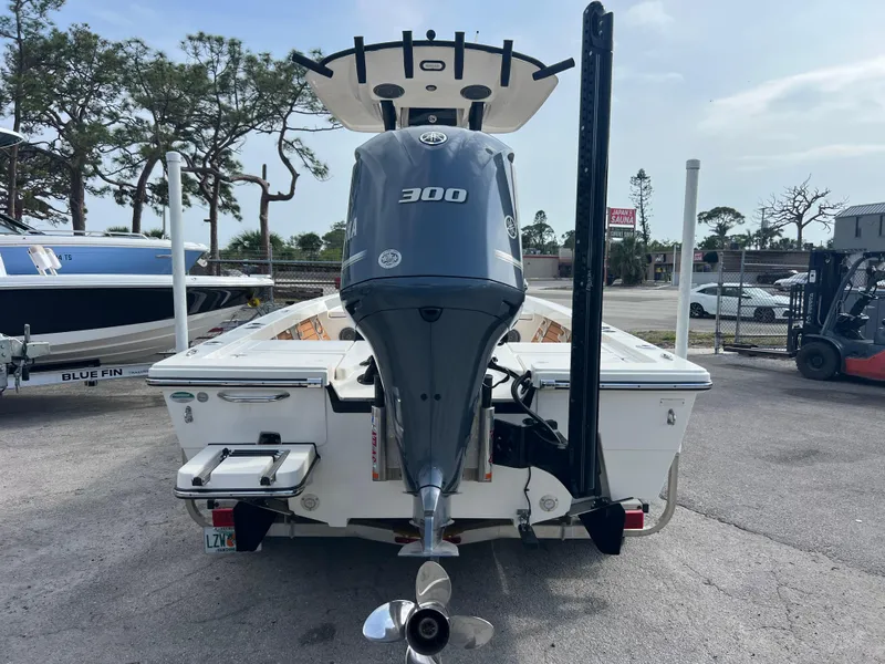 Slide: The Image of 2019 Pathfinder 2400 TRS boat with Yamaha 300 engine, parked outdoors. - 6