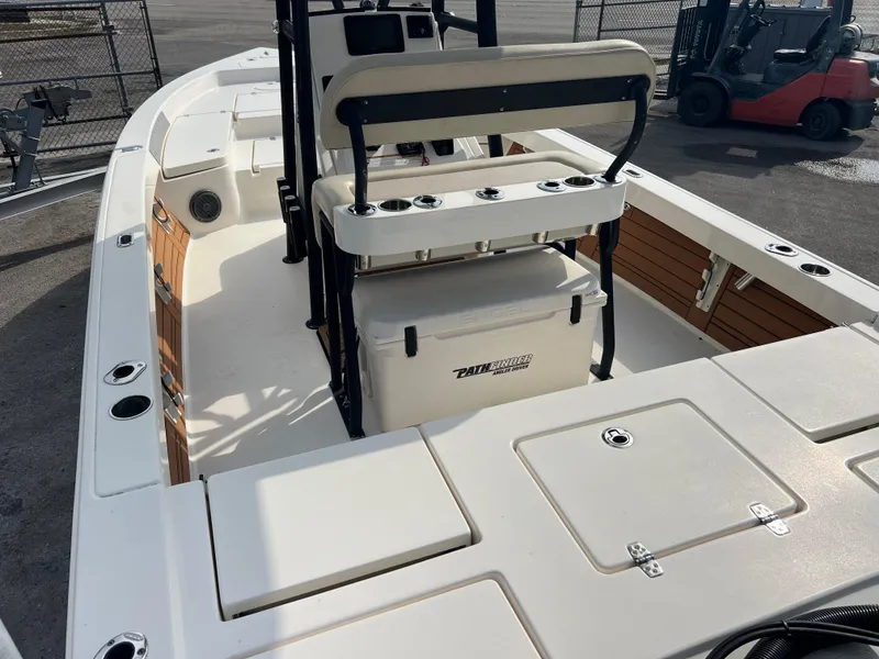 Slide: The Image of 2019 Pathfinder 2400 TRS boat interior with seating and storage compartments. - 7