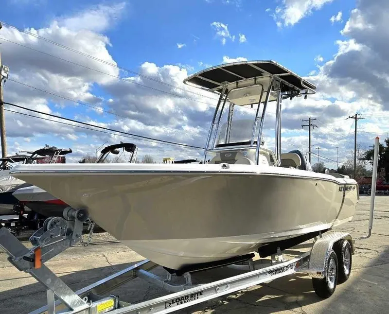 Slide: The Image of 2025 Key West 203 FS boat on trailer under blue sky with clouds. - 4