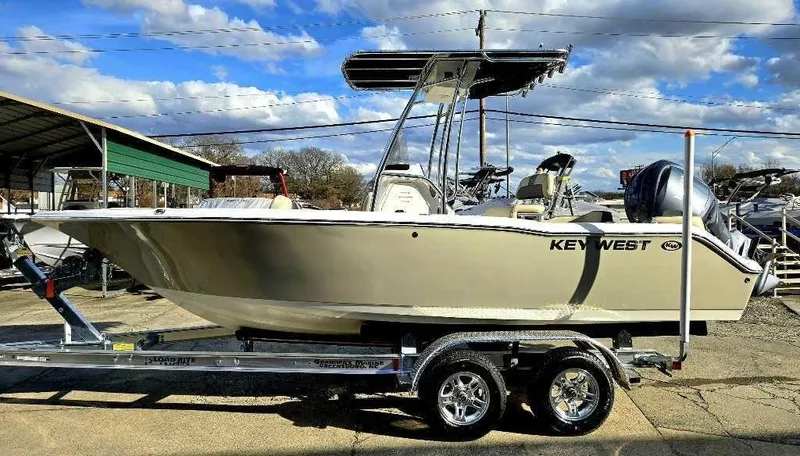 Slide: The Image of 2025 Key West 203 FS boat on trailer under blue sky. - 6