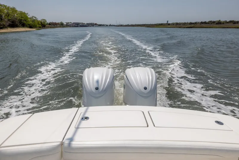 Slide: The Image of Aerial view of 2021 Regulator 28FS boat on calm water. - 7