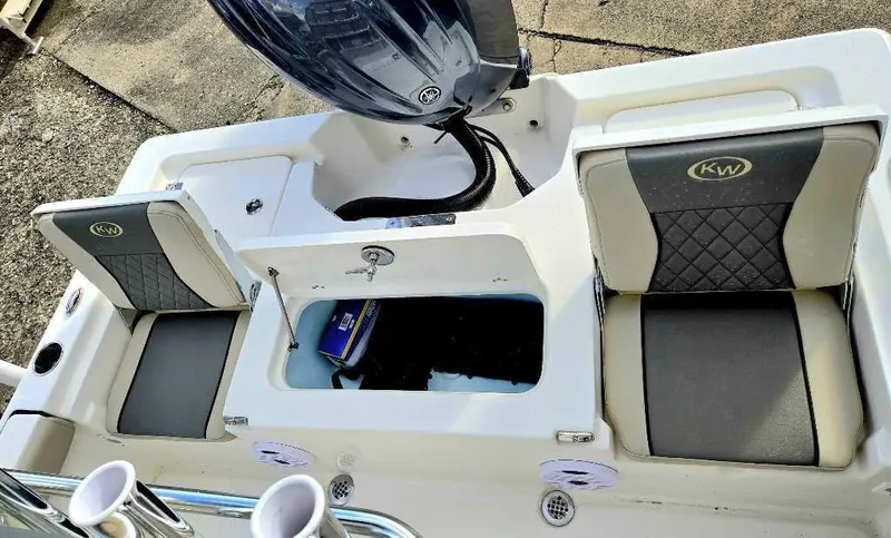 Slide: The Image of 2025 Key West 210 BR boat interior with seating and storage compartments. - 8