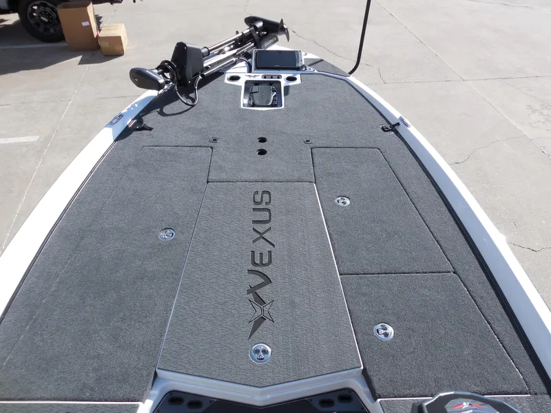 Slide: The Image of 2025 Vexus VXS 21 boat deck with storage compartments and trolling motor. - 10