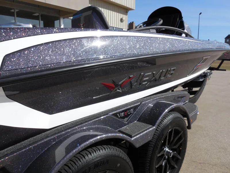 Slide: The Image of 2025 Vexus VXS 21 boat with sparkling finish on a trailer, side view. - 6