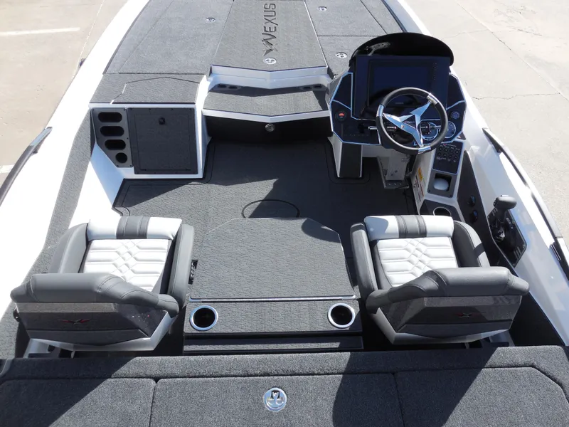 Slide: The Image of 2025 Vexus VXS 21 boat interior with dual seats and modern dashboard. - 7