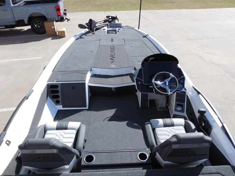 Slide: The Image of 2025 Vexus VXS 21 boat interior with dual seats and steering console. - 8