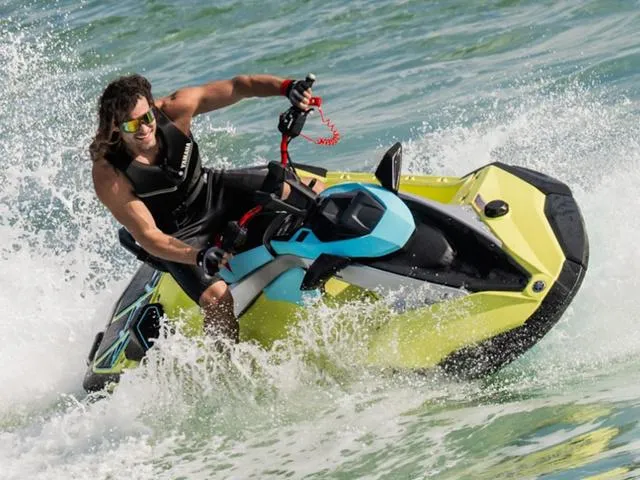 Slide: The Image of 2025 Yamaha Waverunner Jetblaster in action on ocean waves. - 10