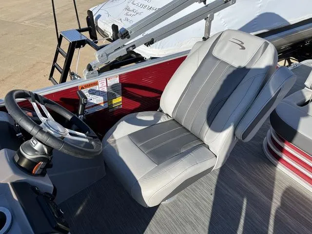 Slide: The Image of Captain's seat and steering wheel of 2022 Bennington 23 SSBX boat. - 11