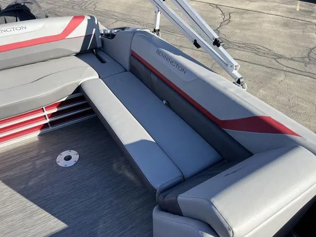 Slide: The Image of 2022 Bennington 23 SSBX boat interior with gray and red seating. - 5