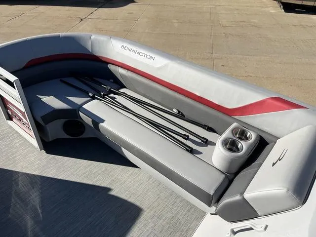 Slide: The Image of 2022 Bennington 23 SSBX boat interior with seating and cup holders. - 9