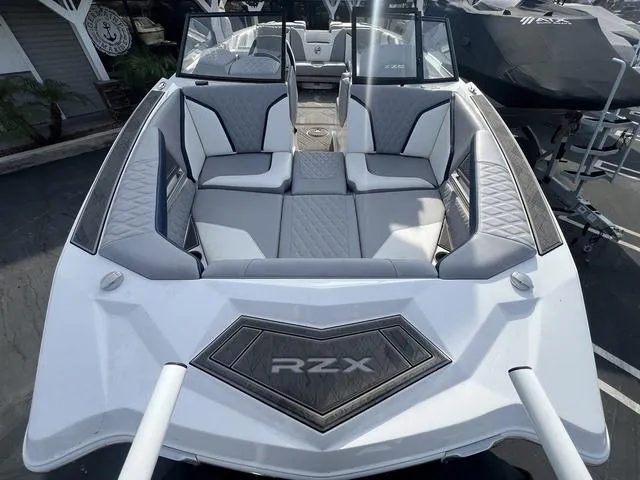Slide: The Image of 2024 Tigé 24RZX boat with sleek gray interior and modern design. - 5