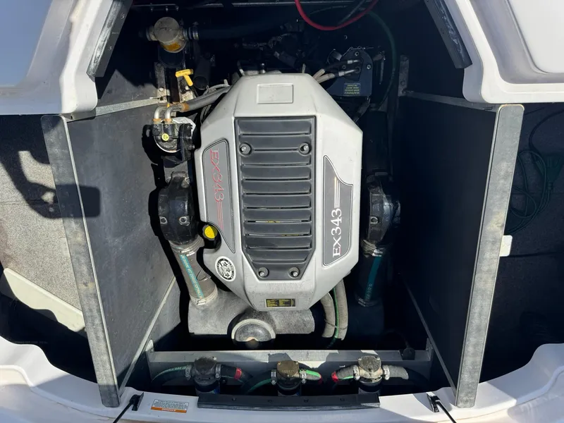 Slide: The Image of 2008 Nautique Super Air 220 boat engine compartment with EX343 engine. - 11