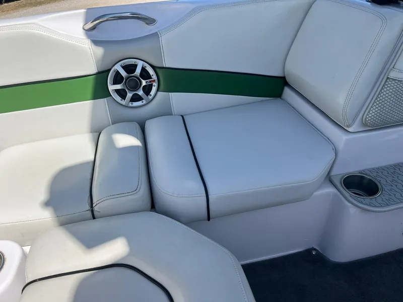 Slide: The Image of 2008 Nautique Super Air 220 boat interior with white seating and green accent. - 14