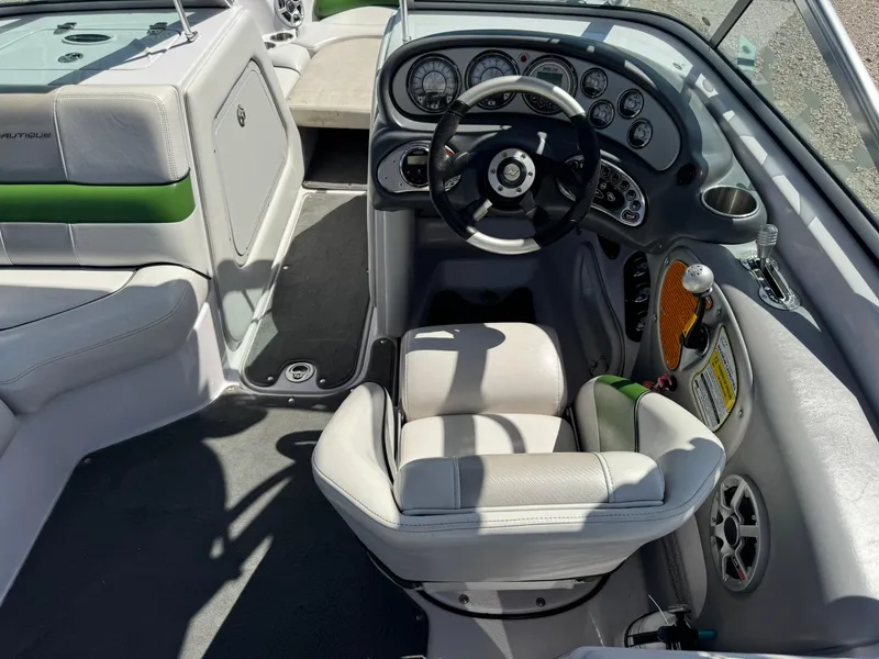Slide: The Image of 2008 Nautique Super Air 220 boat interior with steering wheel and dashboard controls. - 17