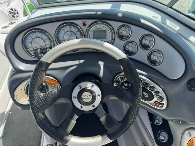 Slide: The Image of Steering wheel and dashboard of 2008 Nautique Super Air 220 boat. - 18