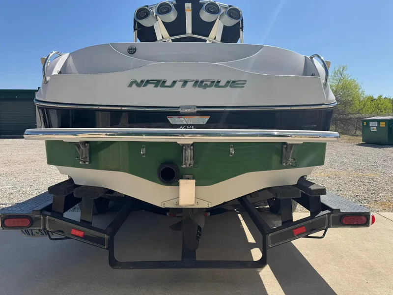 Slide: The Image of 2008 Nautique Super Air 220 boat on trailer, rear view, outdoors. - 2